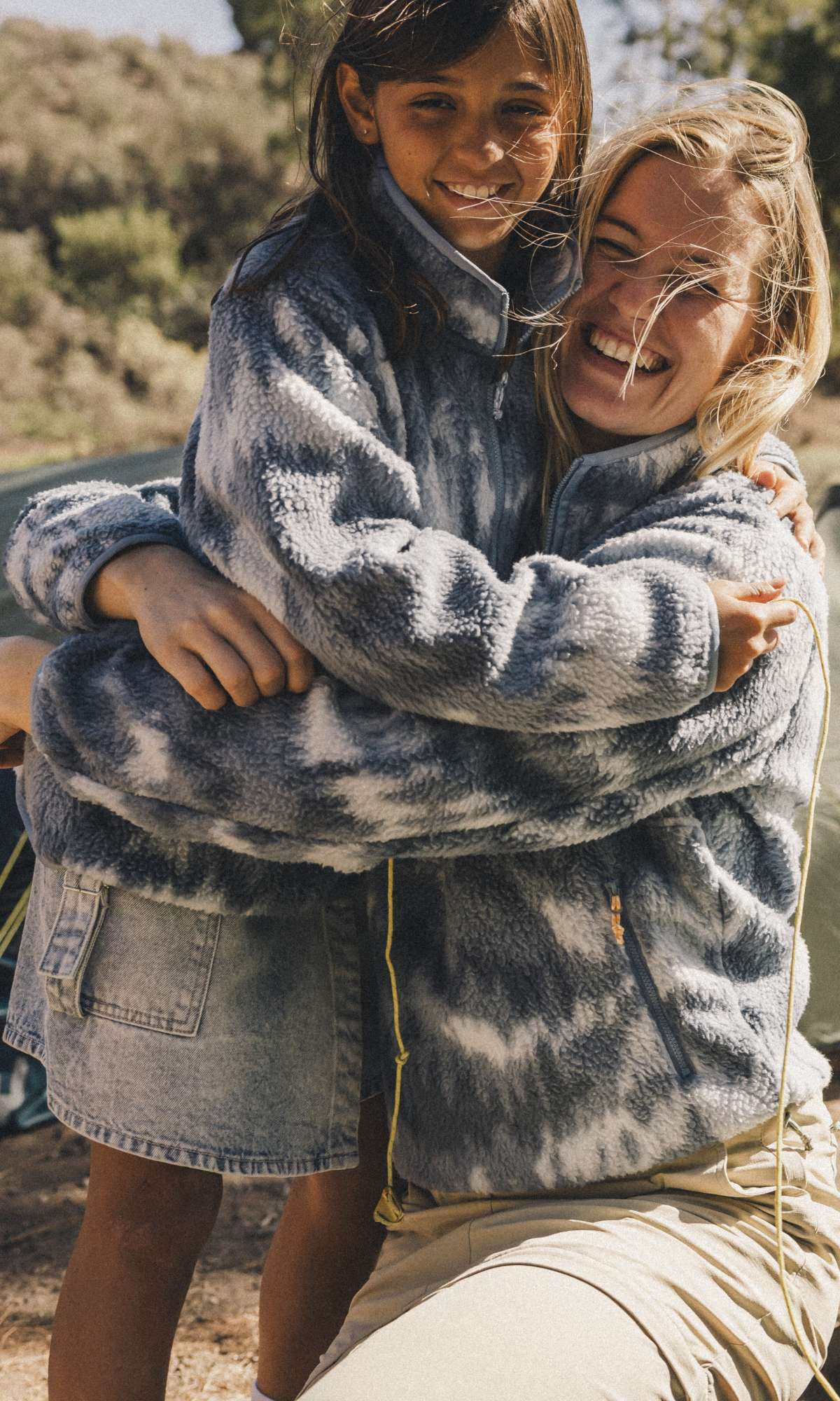 Woman and girl wearing matching Ayacucho fleeces