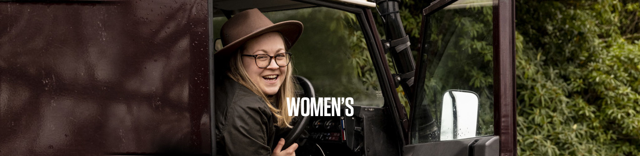 Woman in a car wearing a jacket